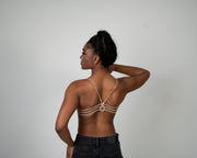Woman wearing luxury lingerie with a backless serpentine bra back